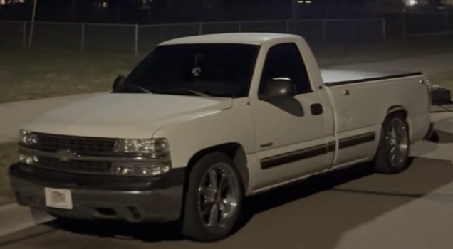 Slammed custom truck on air ride in dim warehouse